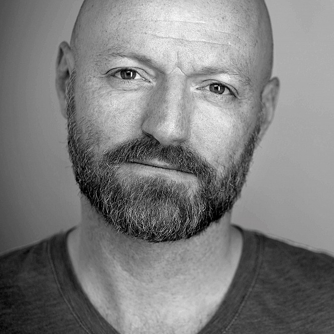 Headshot of voice actor Erik Madsen